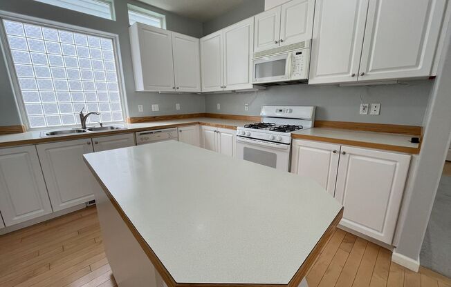 Inviting 4-Bedroom, 3-Bathroom Home with Vaulted Ceilings, Double-Sided Fireplace & Serene Outdoor Space