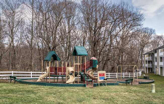 a playground with a swing set and slides