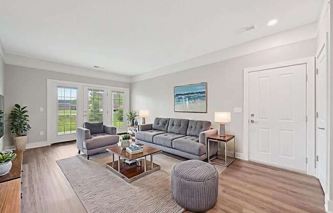 A living room with a grey couch and a coffee table.