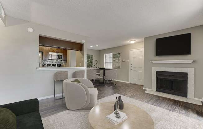 A living room with a fireplace and a television.
