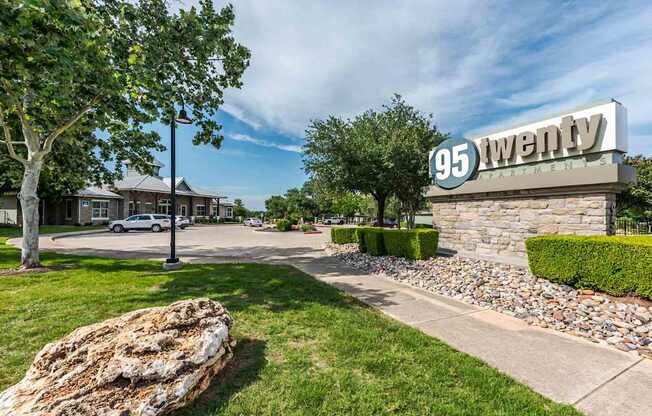 A sign that says 95 Twenty in front of a building.