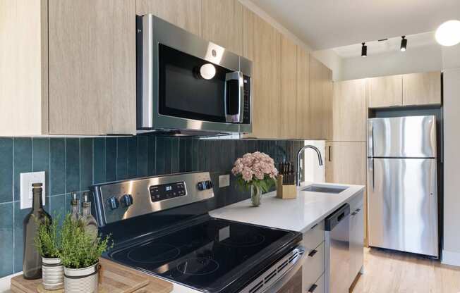 a kitchen with stainless steel appliances and a stove