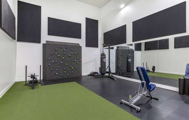 Experience our state-of-the-art gym featuring a dynamic climbing wall and exercise equipment at Boulders at Lookout Mountain Apartment Homes, Phoenix, 85022