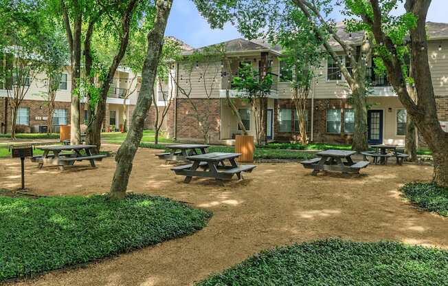 Pet-Friendly Apartments in Houston, TX – Westchase Forest – Photo of our apartments have a spacious courtyard with picnic tables