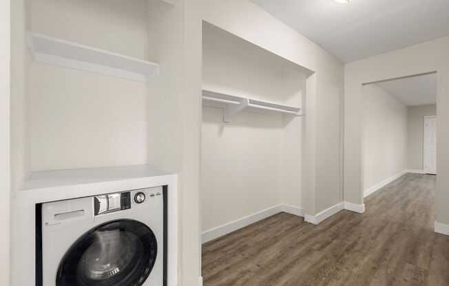 a laundry room with a washer and dryer