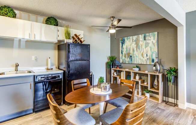 a kitchen and dining area in a 555 waverly unit  at ReNew at Neill Lake, Eden Prairie, MN