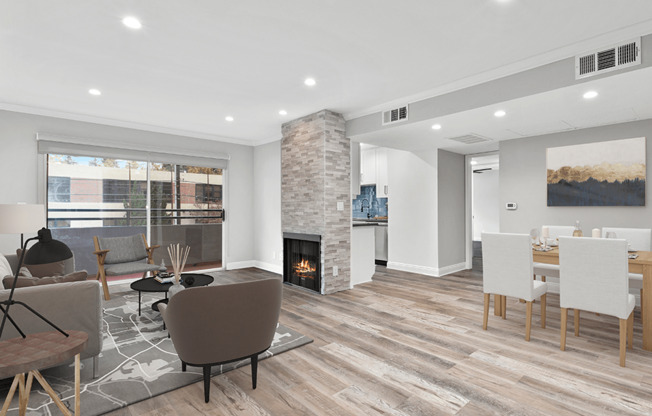 Hardwood floored living room with stone walled fireplace.