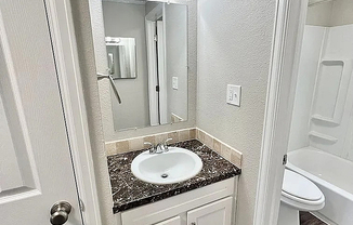 Experience luxury in this modern bathroom with a sleek design and elegant finishes.