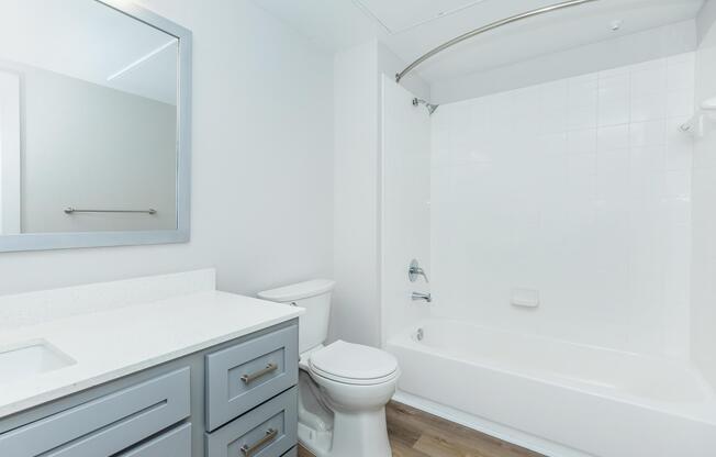 a kitchen with a sink and a mirror