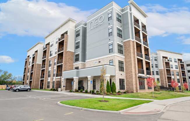 an apartment building with a car parked in front of it