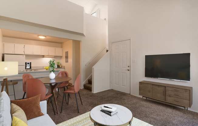 a living room with a couch and a table and a television