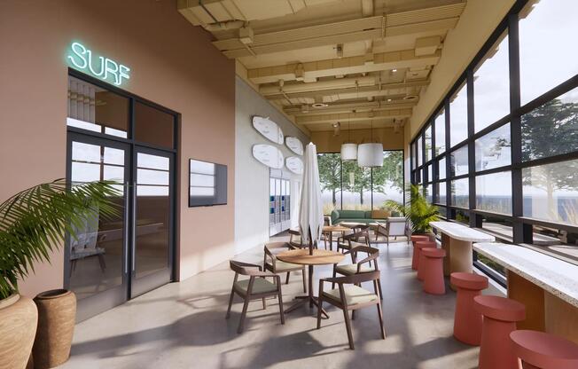 Surf Shack lounge with open-air doors and a variety of seating options facing the shore.