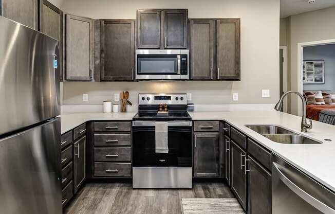 Kitchen with stainless steel appliances at Hanover Flats in Bennington, NE