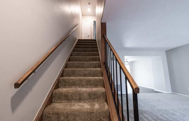 Stairway in the Two Bedroom Townhome at Woodbridge Apartments Bloomington