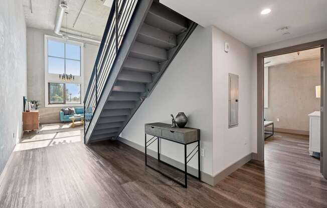 A modern interior with a staircase leading to the upper floor. at The Mansfield at Miracle Mile, Los Angeles