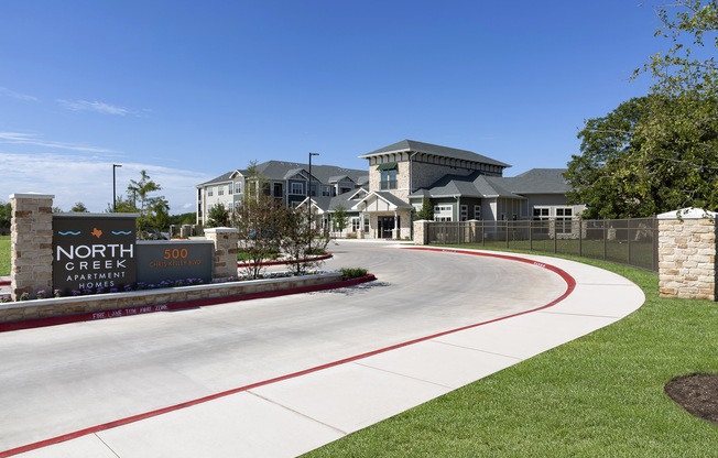 the entrance to the neighborhood apartments at North Creek, Hutto, TX