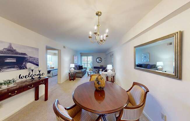 a separate dining space with a chandelier