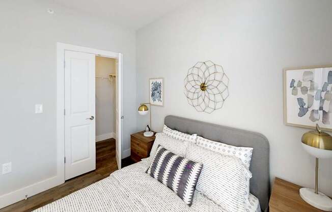 bedroom with white bedding at Echo Park at Perry Crossing Apartments, Plainfield, 46168