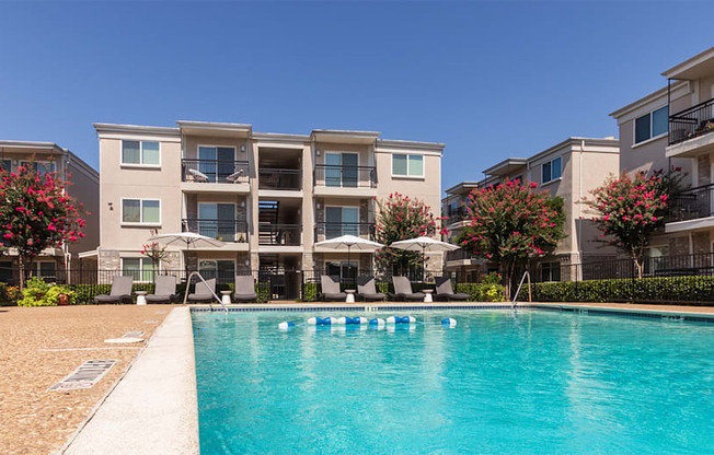 This is a photo of the pool area at The Summit at Midtown Apartments in Dallas, TX.