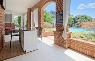 A patio with a white table and chairs is shown.