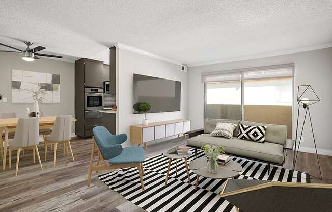 Hardwood floored living room with view of dining room and kitchen.