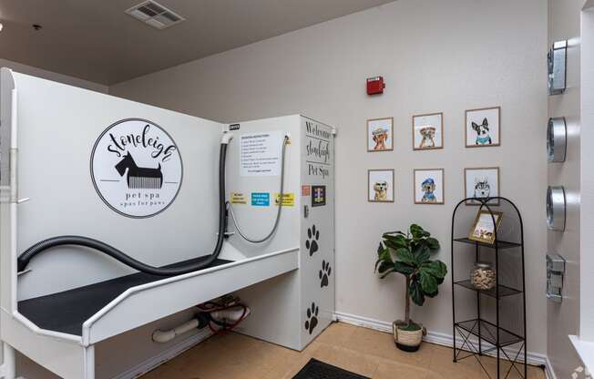 a rehabilitation room with a treadmill and a refrigerator and a plant