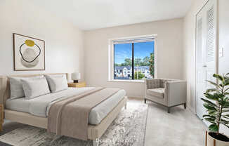 A bedroom with a large bed and a window and closet at South Bridge Apartments, Indiana