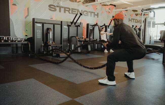 man working out with battle ropes in Pixon fitness center at Lake Nona Pixon, Orlando, FL, 32827