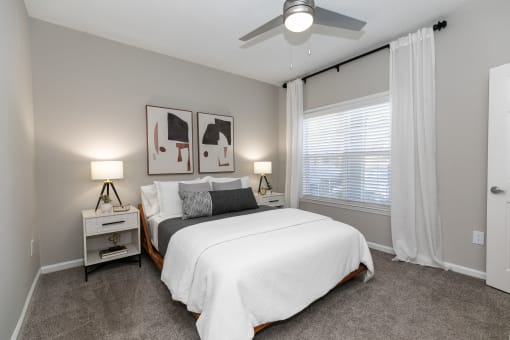 a bedroom with a bed and a ceiling fan at Willowest in Collier Hills, Georgia