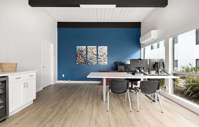 A room with a table and chairs in it.