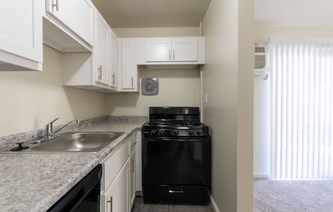 This is a photo of the kitchen in the 543 square foot B-style, 1 bedroom, 1 bath apartment at Blue Grass Manor Apartments in Erlanger, KY.