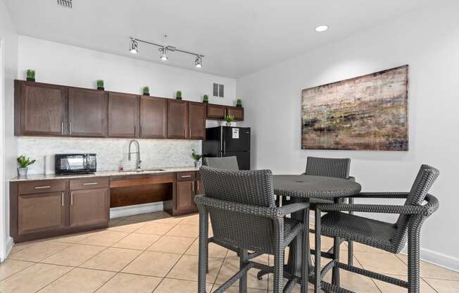 a kitchen and dining area with a table and chairs