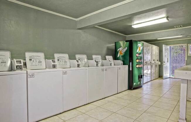 Image of washers and vending machines in community laundry facilities  at Residences at Lakeshore, Oklahoma City, Oklahoma
