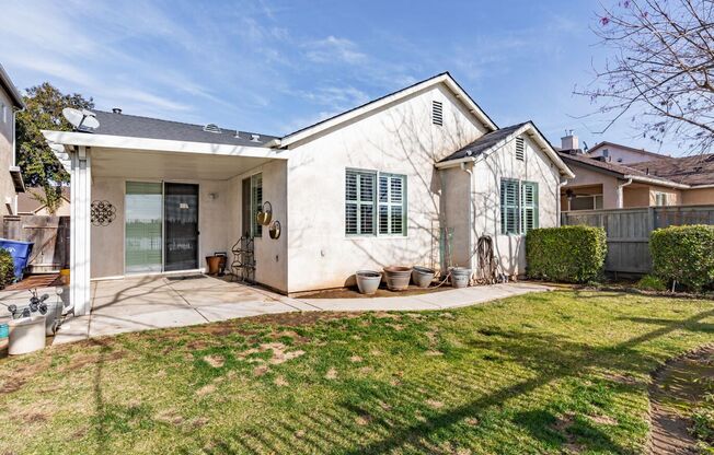 European Parc one-level home w/private rear yard backing to ponding basin