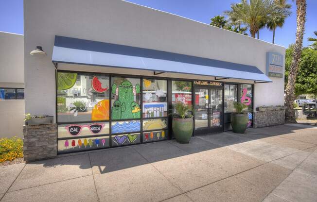 the outside of a store with a window display of fruit and vegetables at Vaseo Apartments, Arizona