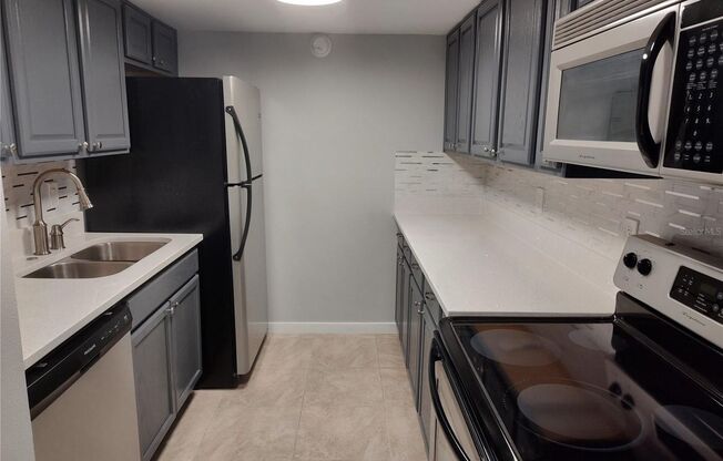 1 Bedroom 1st Floor Del Rey Condo with new stainless appliances and tile flooring