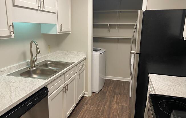 a kitchen with a stove and a sink