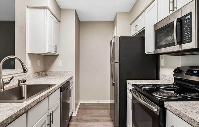 Granite Countertop Kitchen at Newport Colony Apartment Homes, Florida, 32707