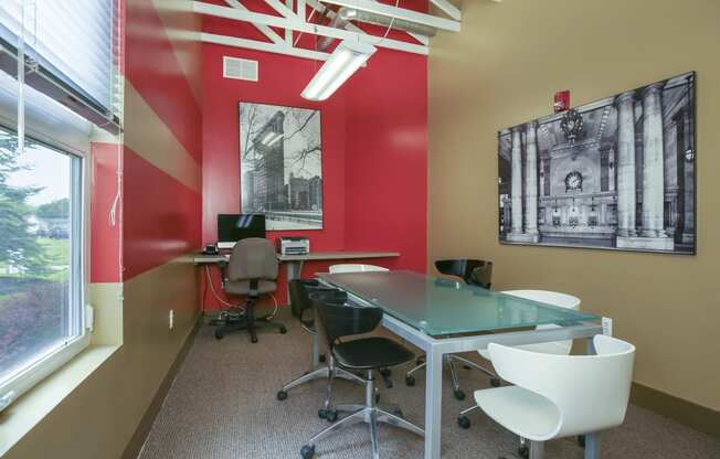 a conference room with a glass table and chairs and a window at Village Club of Rochester Hills, Shelby Township, MI 48317