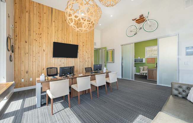 A room with a wooden wall and a television mounted on it.