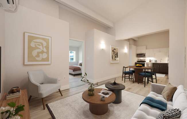 a living room with a couch and a table and a kitchen in the background at Track 281 Apartments, Sacramento, CA