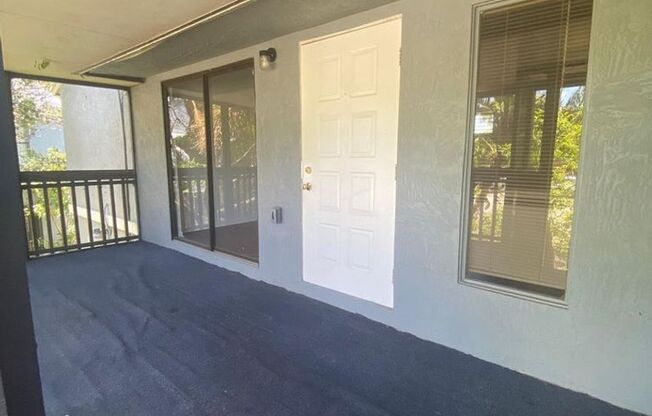 Great 2 bedroom 2 bath condo with screened balcony, private fenced courtyard and storage area