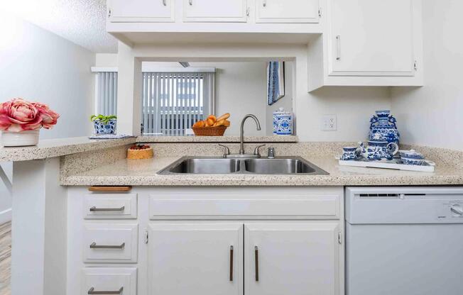 a stove top oven sitting inside of a kitchen