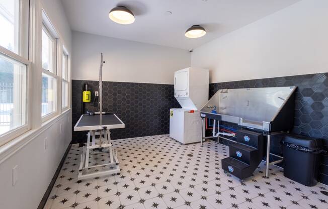 a kitchen with a sink and a refrigerator and a table