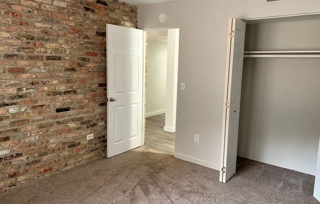 bedroom with brick wall