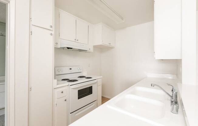 Kitchen with White Appliances and White Cabinets