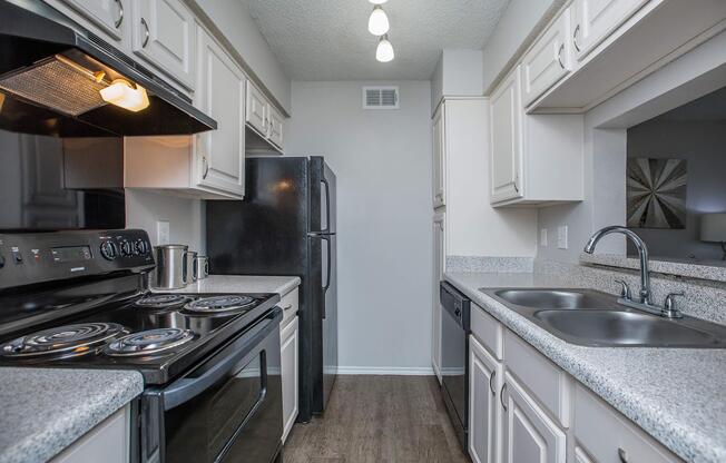 a large kitchen with stainless steel appliances