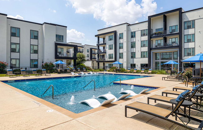 Rhythm Resort-Style Pool with Chaise Lounge Seating and Sundeck