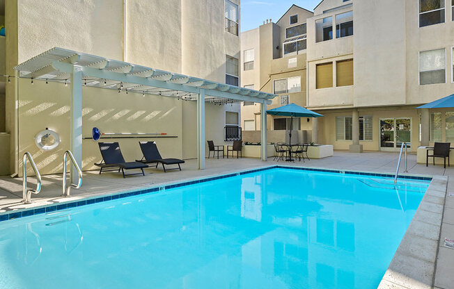 Courtyard pool with lounging and picnic space