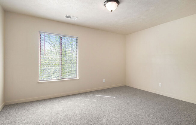 bedroom with a large window at Old Farm Apartments, Elkhart, Indiana